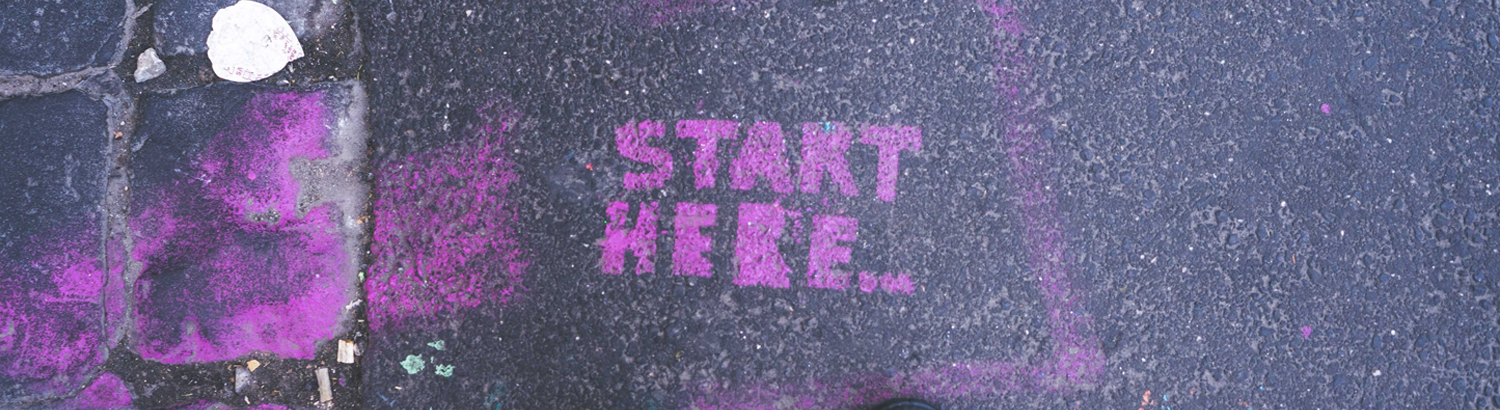 Purple chalk that reads, "Start here."